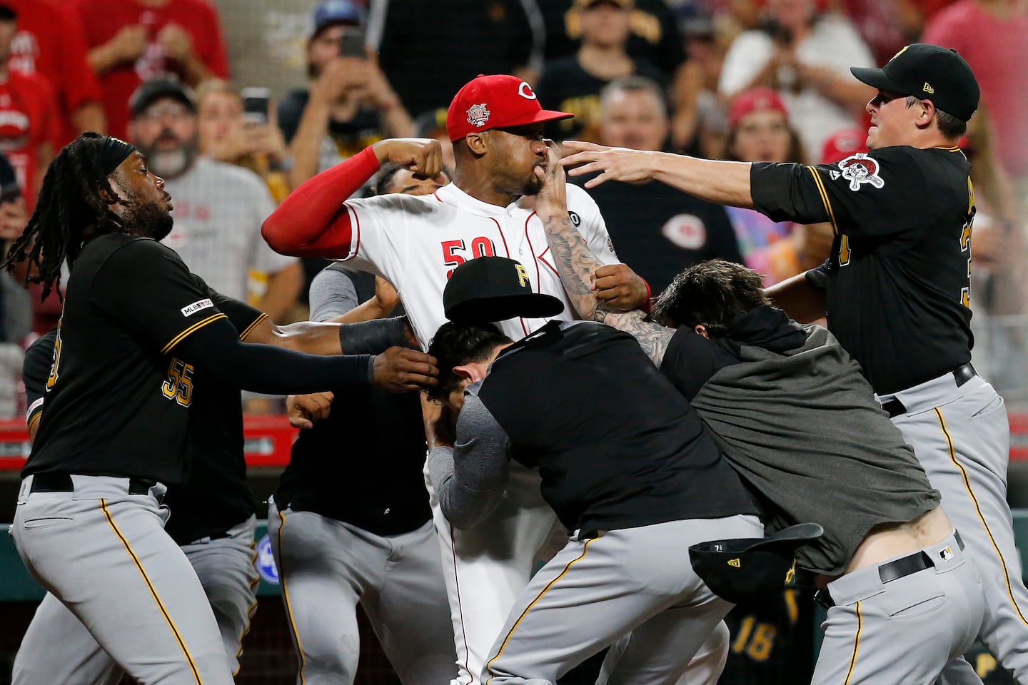Details emerge about the Amir Garrett fight suspension. What consequences did the players face after brawling?