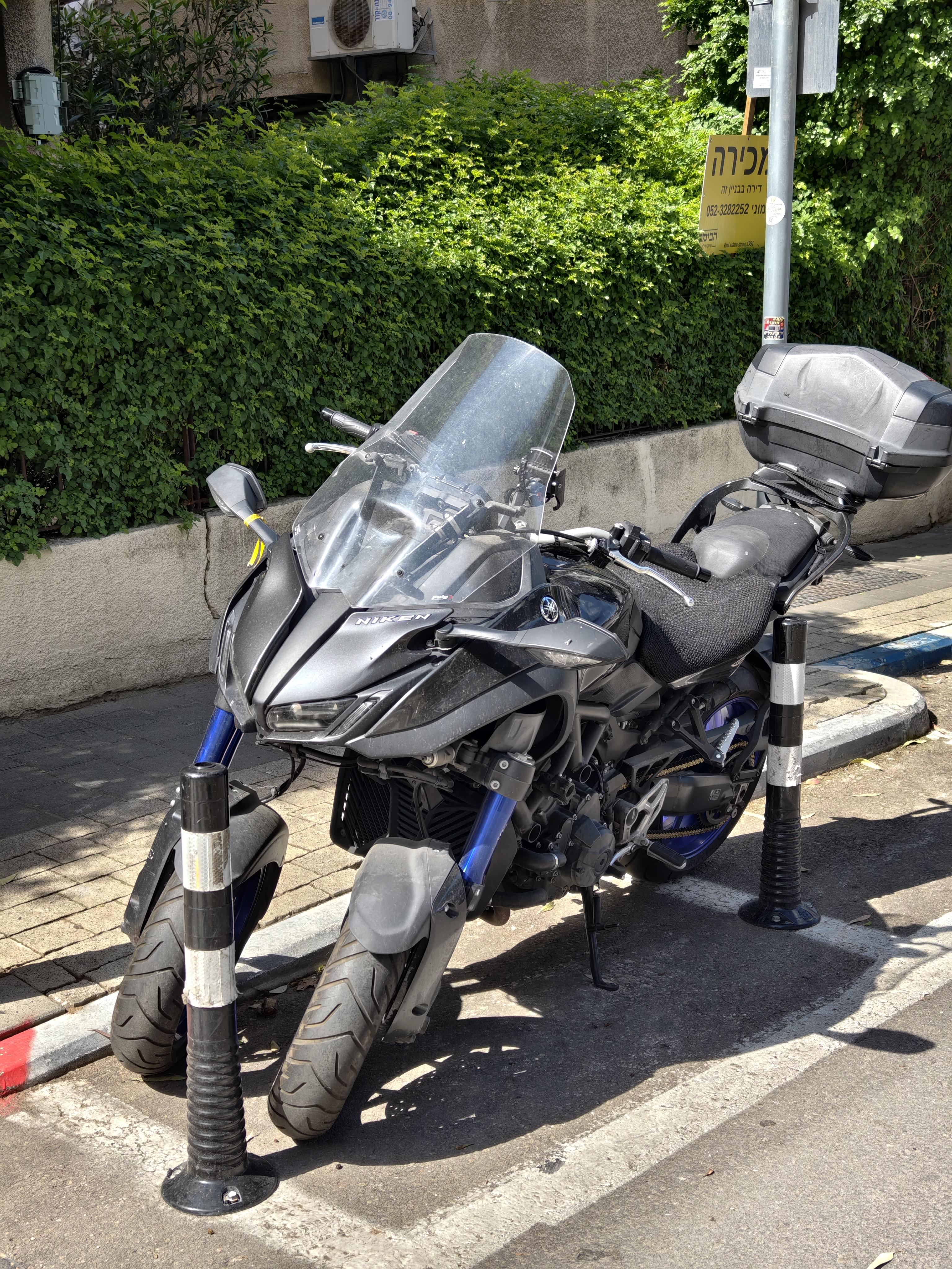 Why do heavy touring bikes often need motorcycle reverse? Learn the practical benefits for easier handling.